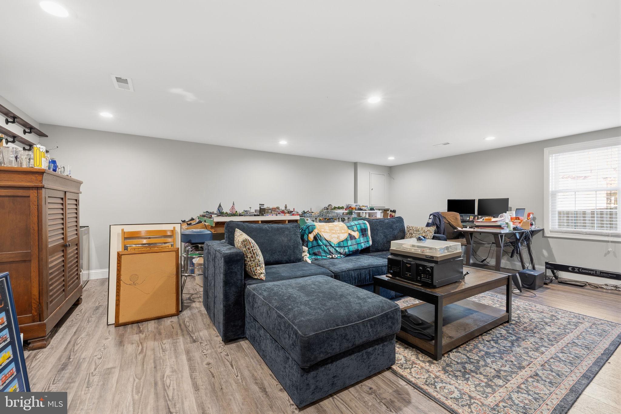 4357 Cub Run Road Chantilly, VA 20151 - Photo 24 of 40 a living room with furniture and a flat screen tv