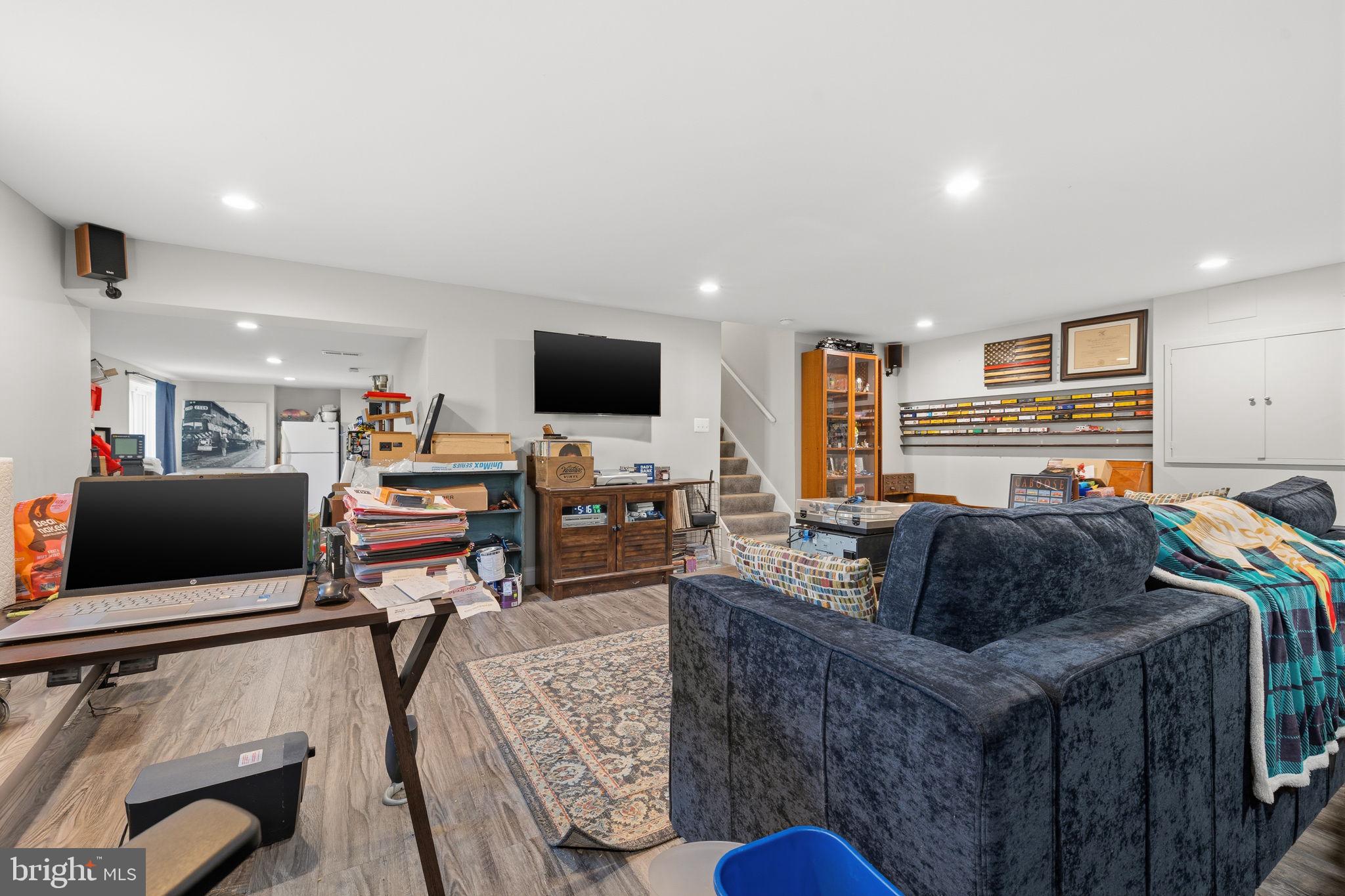 4357 Cub Run Road Chantilly, VA 20151 - Photo 25 of 40 a living room with furniture and a flat screen tv