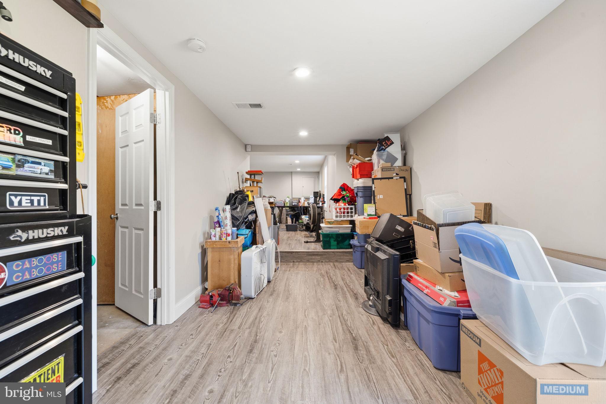 4357 Cub Run Road Chantilly, VA 20151 - Photo 27 of 40 a room with furniture and wooden floor