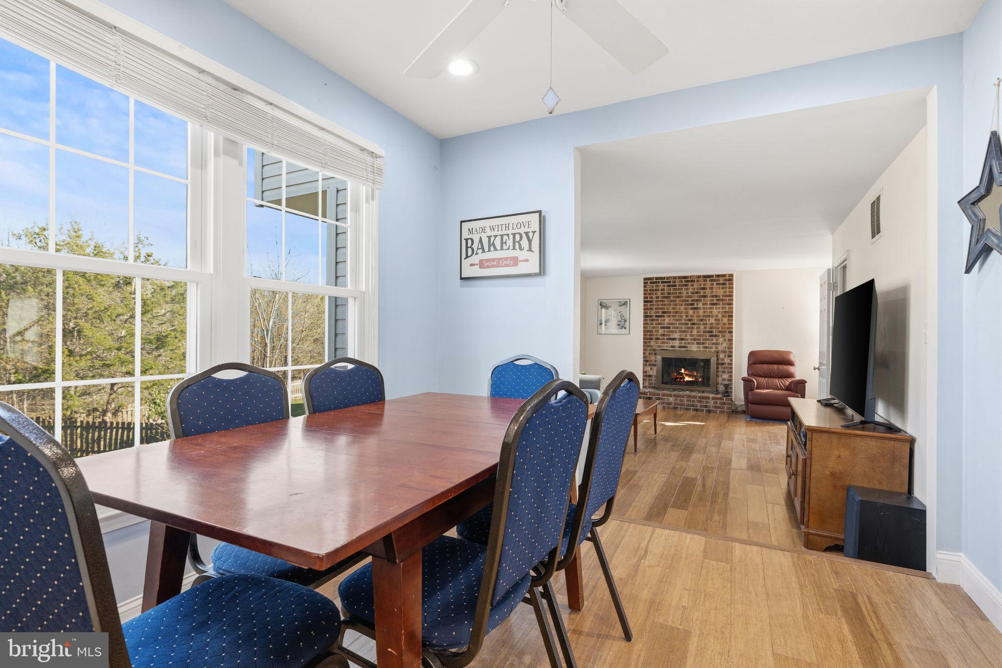 4357 Cub Run Road Chantilly, VA 20151 - Photo 10 of 40 a view of a dining room with furniture window and wooden floor