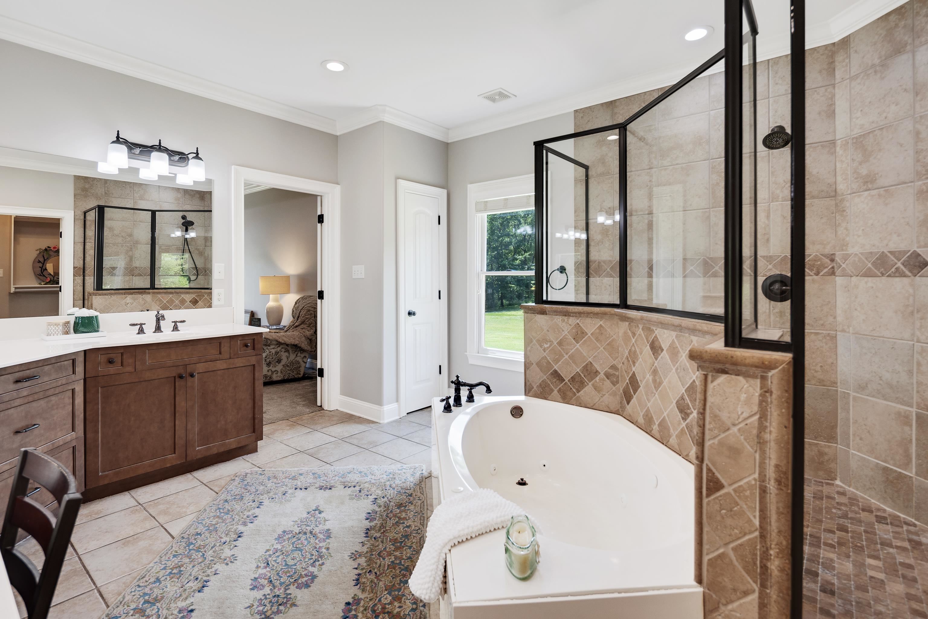 9028 Osborntown Road Arlington, TN 38002 - Photo 25 of 40 a bathroom with a tub sink and mirror