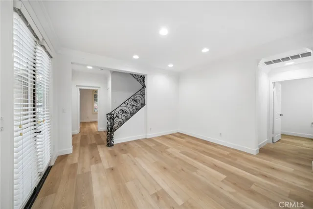 a view of an entryway with wooden floor
