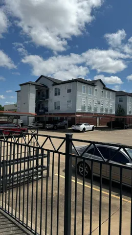 a view of a chairs and table on the roof deck