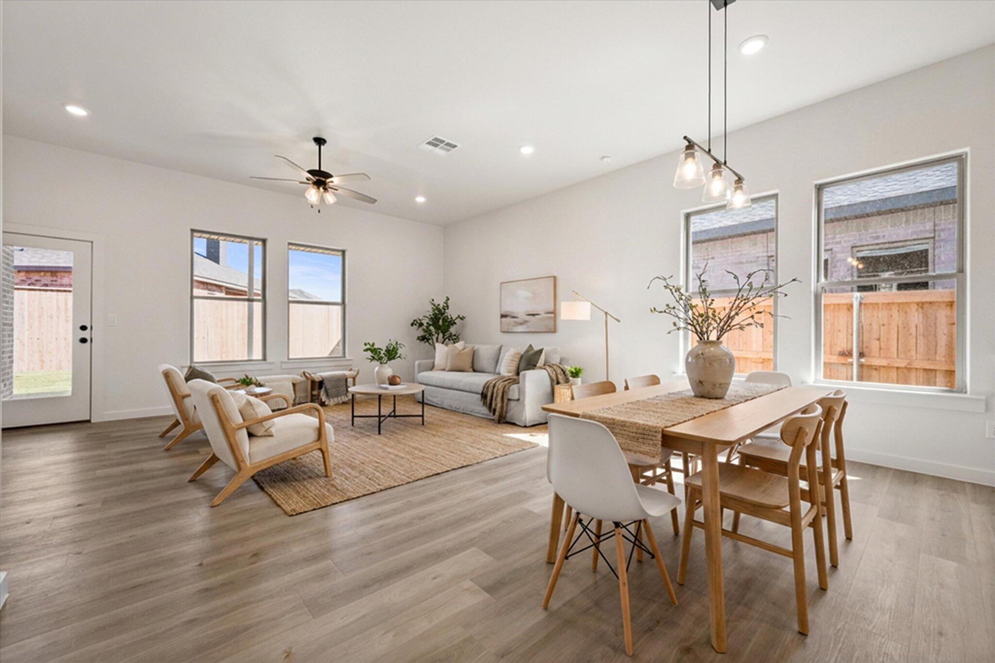 7003 53rd Street Lubbock, TX 79407 - Photo 3 of 25 a living room with furniture dining table and a window