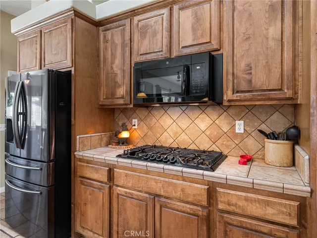 a kitchen with a sink and a refrigerator