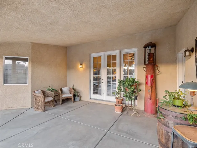 a view of a house with backyard sitting area and garden