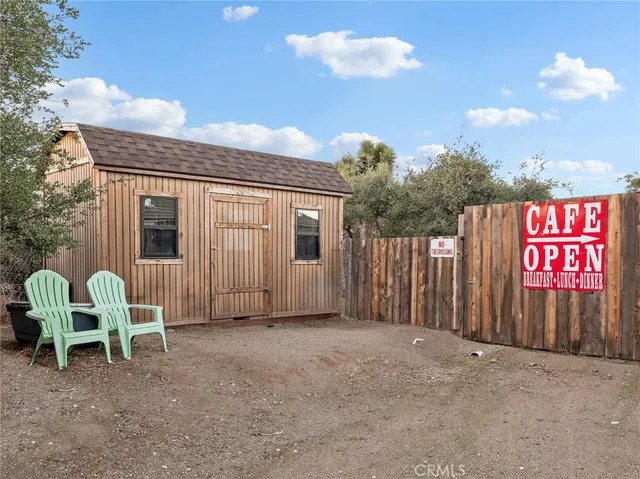 a kitchen with stainless steel appliances kitchen island granite countertop a refrigerator and a stove top oven