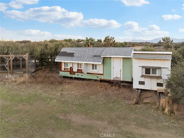 a view of a balcony with an outdoor seating