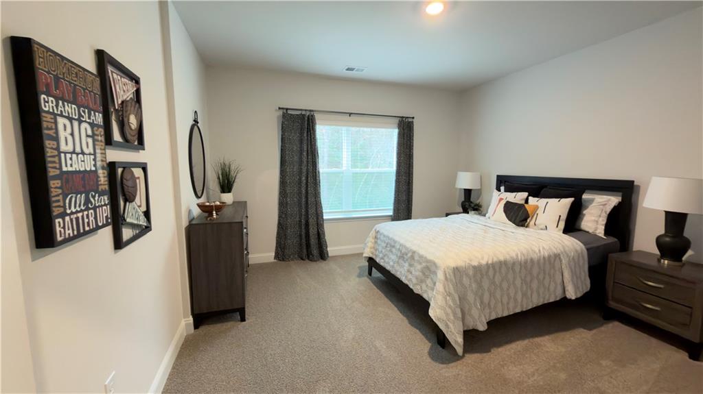 620 Bald Ridge Circle Demorest, GA 30535 - Photo 40 of 43 a bedroom with a bed closet and a window