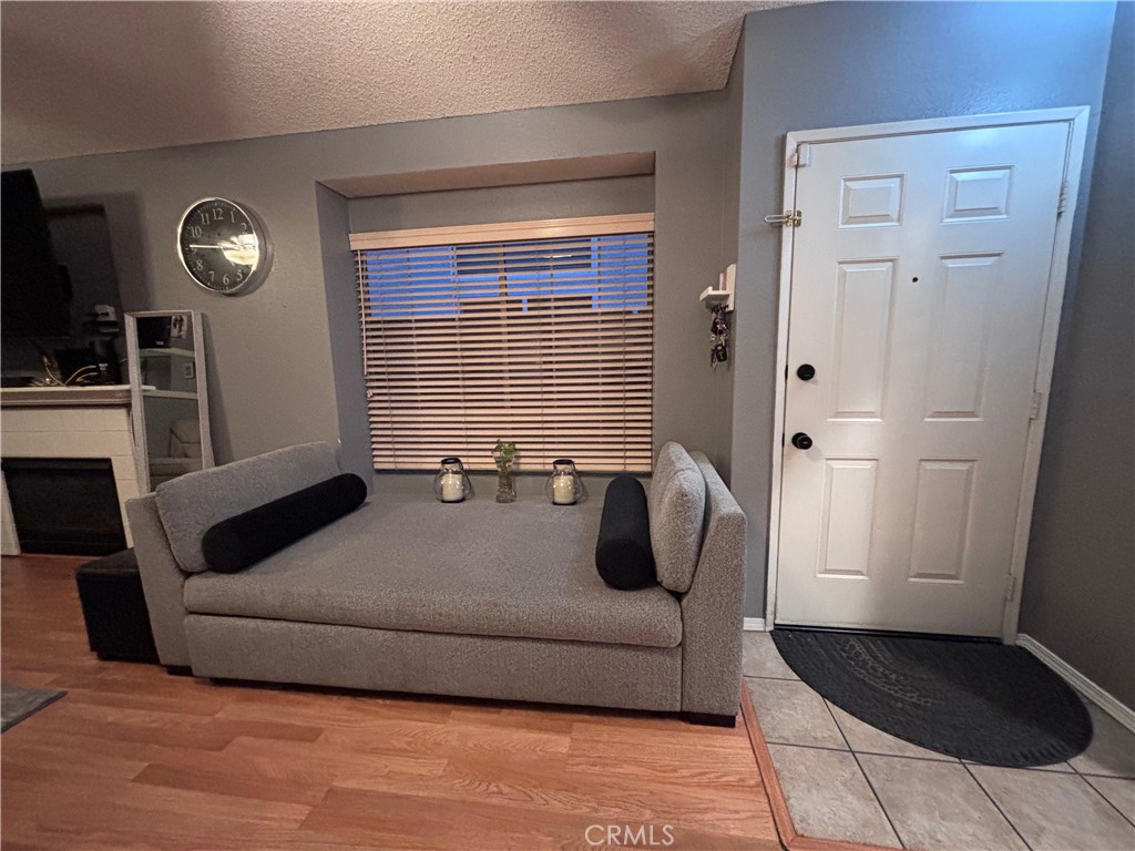 560 Coudures Way Perris, CA 92571 - Photo 15 of 35 a living room with furniture and a flat screen tv