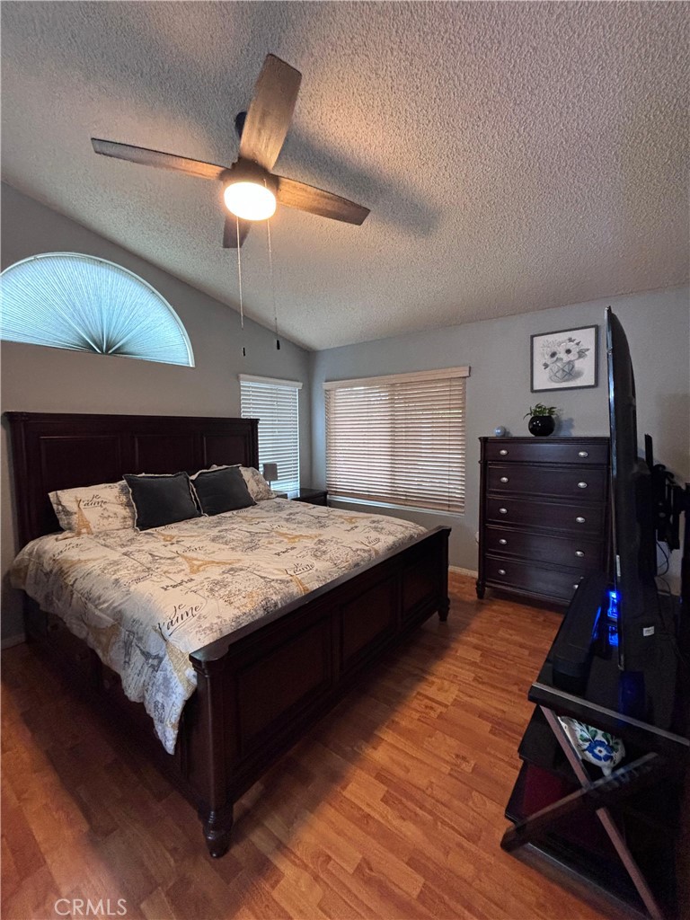 560 Coudures Way Perris, CA 92571 - Photo 16 of 35 a bedroom with a bed and dresser