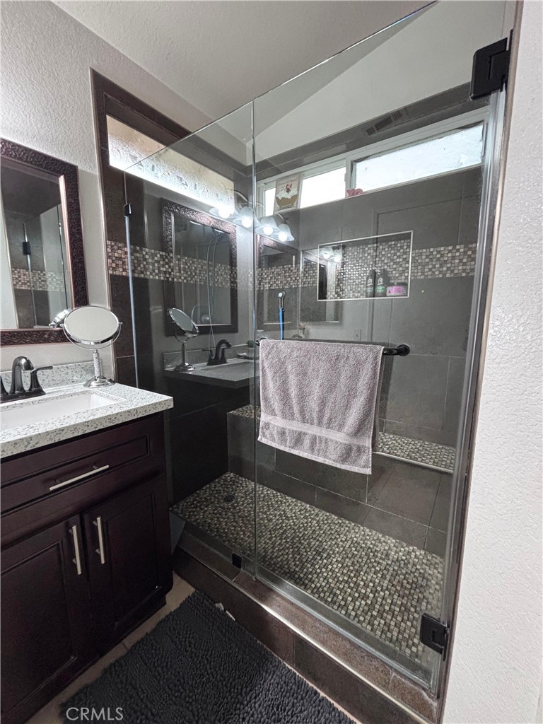 560 Coudures Way Perris, CA 92571 - Photo 2 of 35 a bathroom with a sink and a mirror