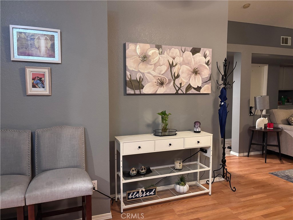 560 Coudures Way Perris, CA 92571 - Photo 25 of 35 a room with furniture and a wooden floor