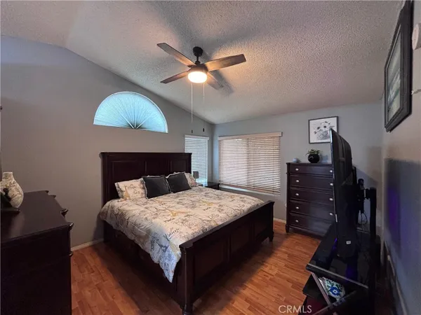 a bedroom with a bed and dresser