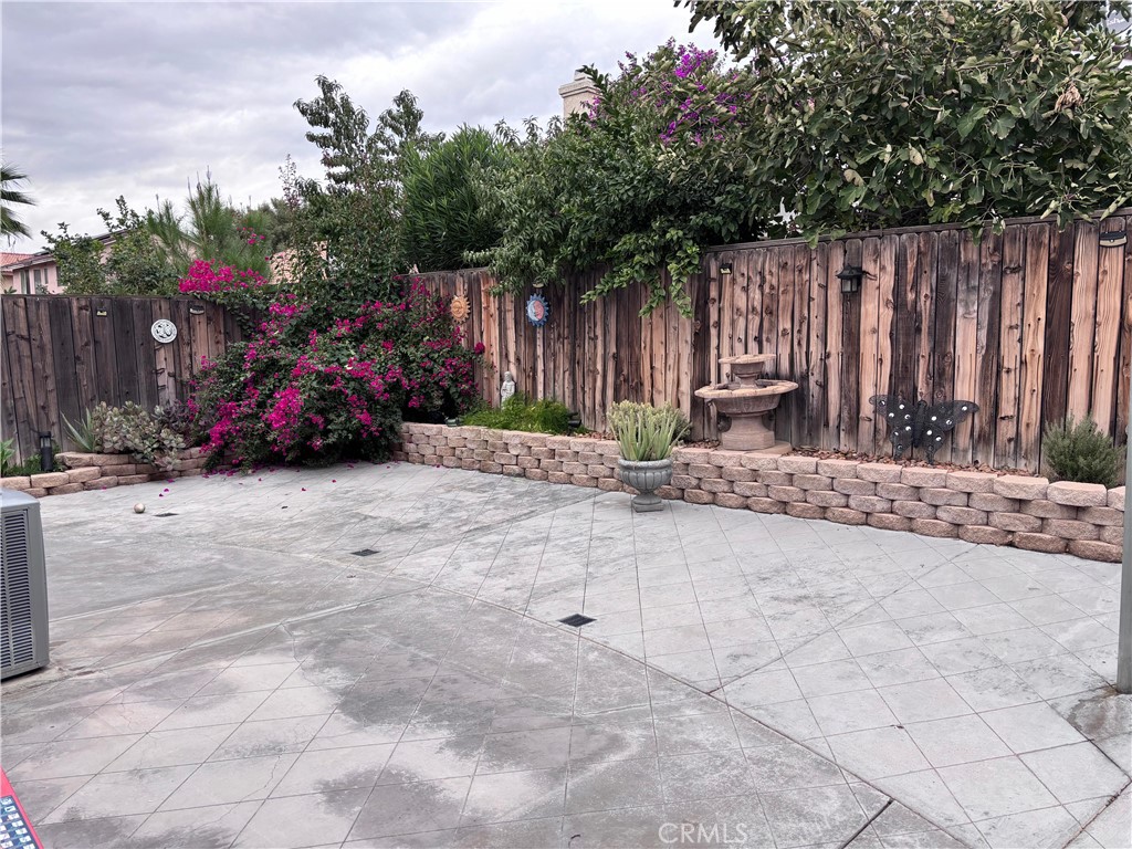 560 Coudures Way Perris, CA 92571 - Photo 35 of 35 a view of backyard with small cabin and a chair