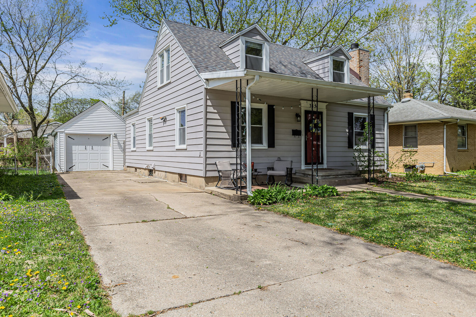 315 South Garfield Avenue Champaign, IL 61821 - Photo 1 of 28 a front view of a house with a garden