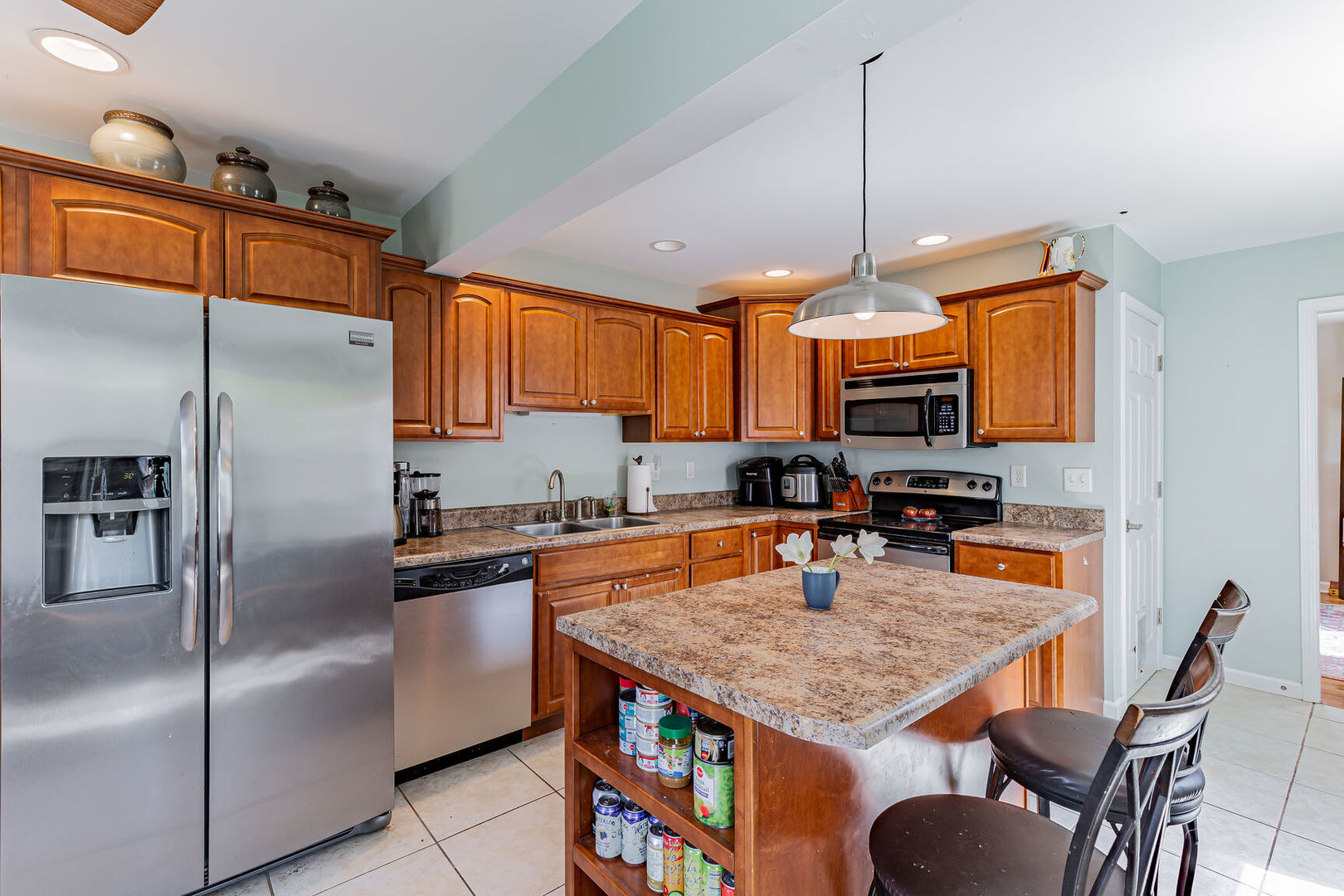 315 South Garfield Avenue Champaign, IL 61821 - Photo 11 of 28 a kitchen with stainless steel appliances granite countertop a stove refrigerator sink and microwave