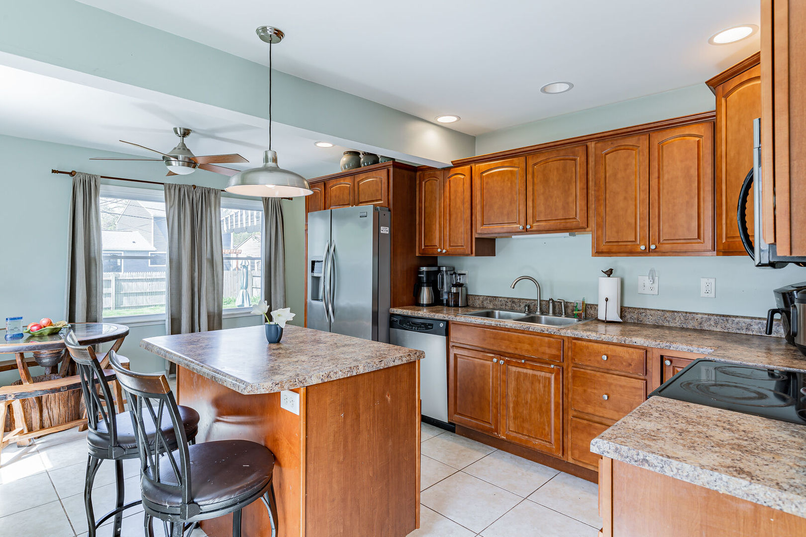 315 South Garfield Avenue Champaign, IL 61821 - Photo 13 of 28 a kitchen with granite countertop sink table and chairs