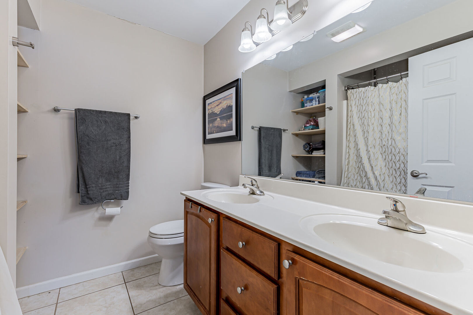 315 South Garfield Avenue Champaign, IL 61821 - Photo 18 of 28 a bathroom with a sink double vanity and a toilet