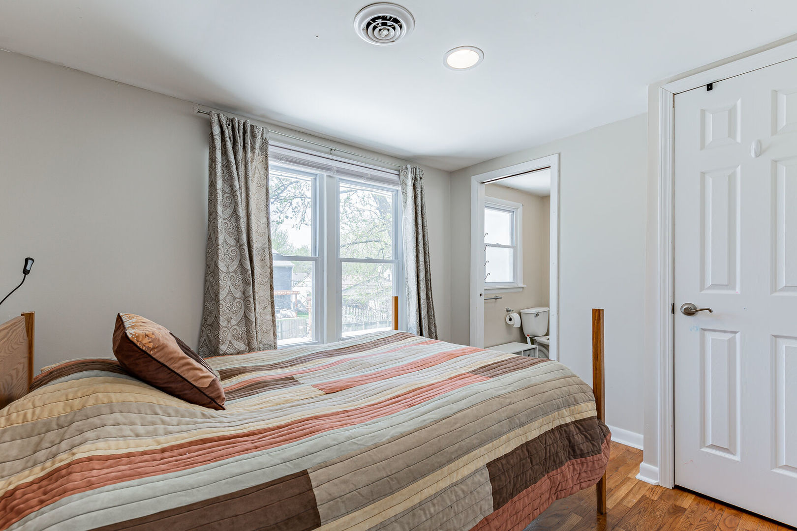 315 South Garfield Avenue Champaign, IL 61821 - Photo 21 of 28 a bedroom with a bed and wooden floor