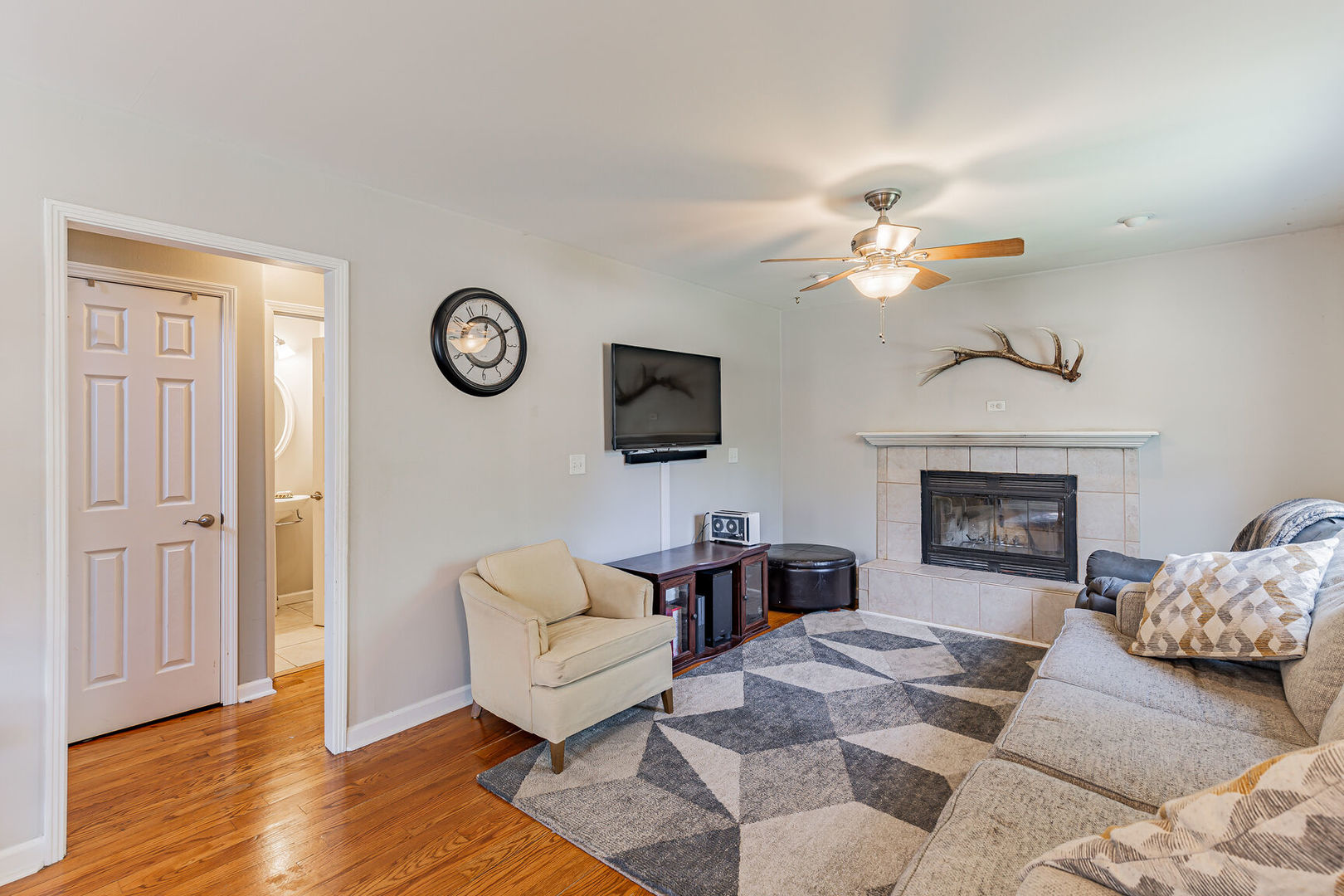 315 South Garfield Avenue Champaign, IL 61821 - Photo 5 of 28 a living room with furniture a fireplace and wooden floor