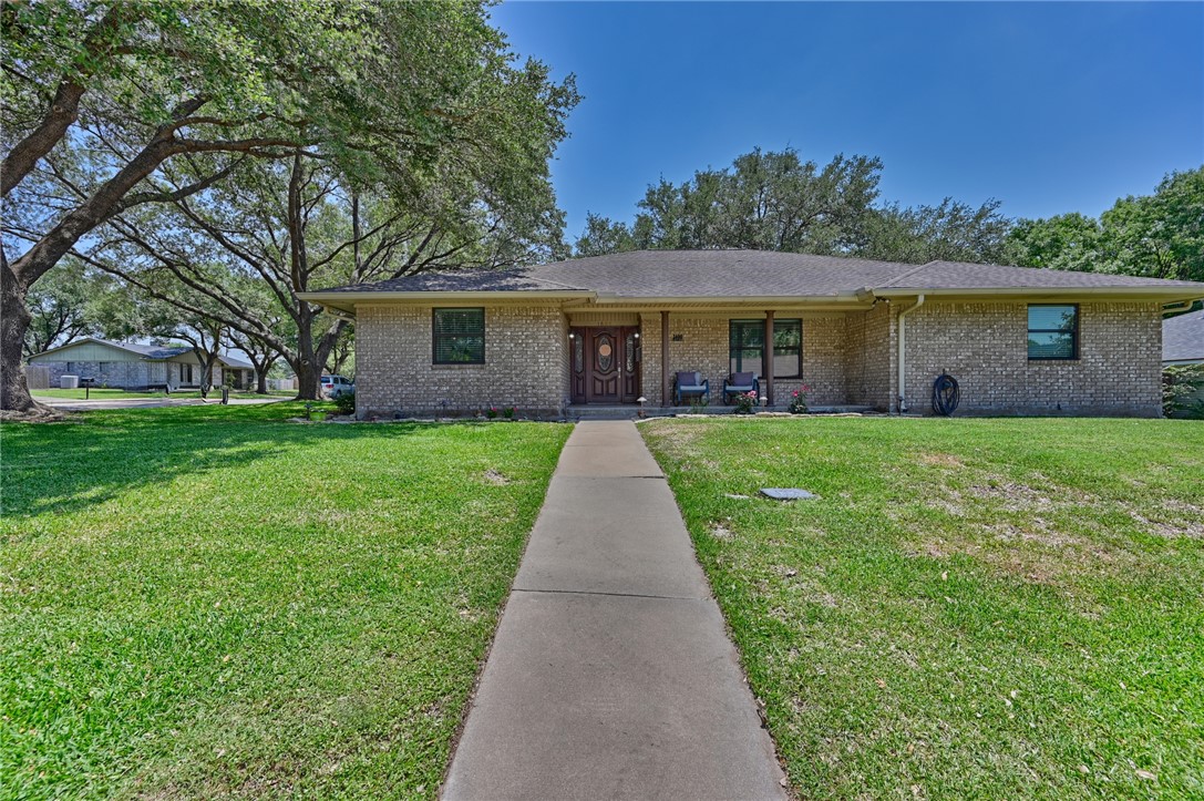 1600 Pecan Street Brenham, TX 77833 - Photo 5 of 33 View of front of house with brick siding, concrete sidewalk and a front yard