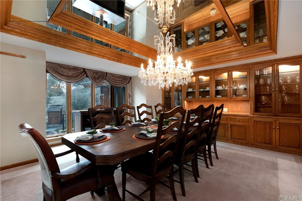 488 Highway 2 Wrightwood, CA 92397 - Photo 16 of 54 a view of a dining room with furniture and chandelier