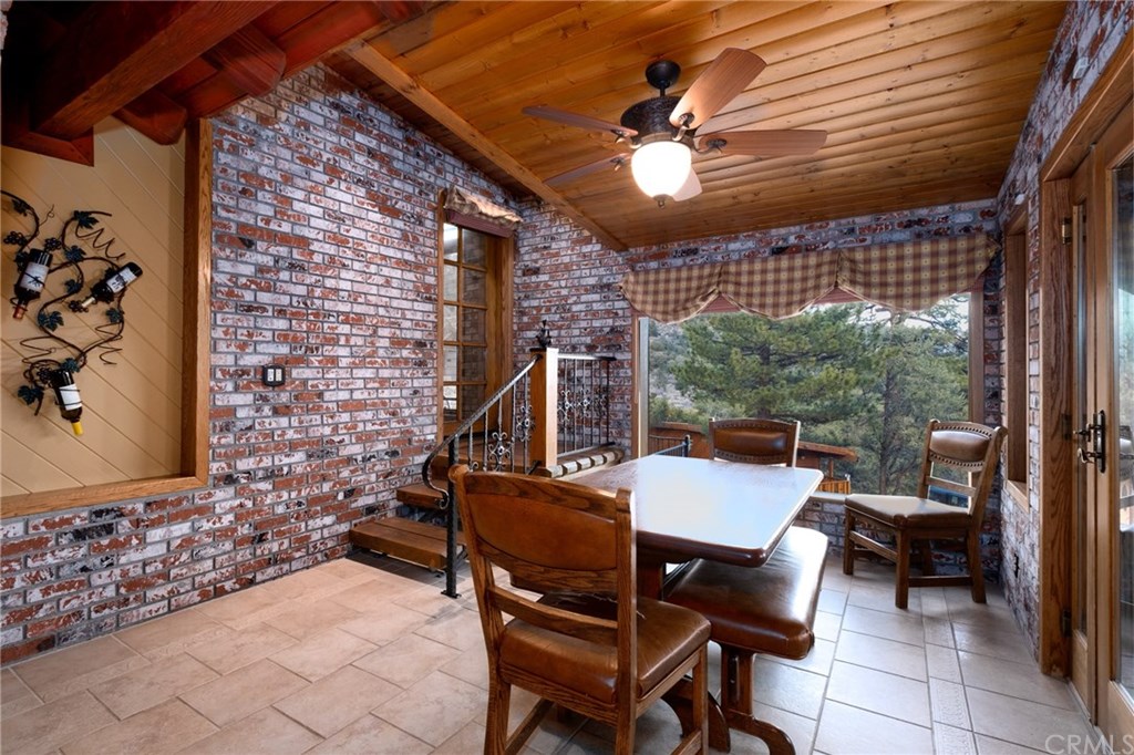 488 Highway 2 Wrightwood, CA 92397 - Photo 18 of 54 a view of a patio with a table and chairs