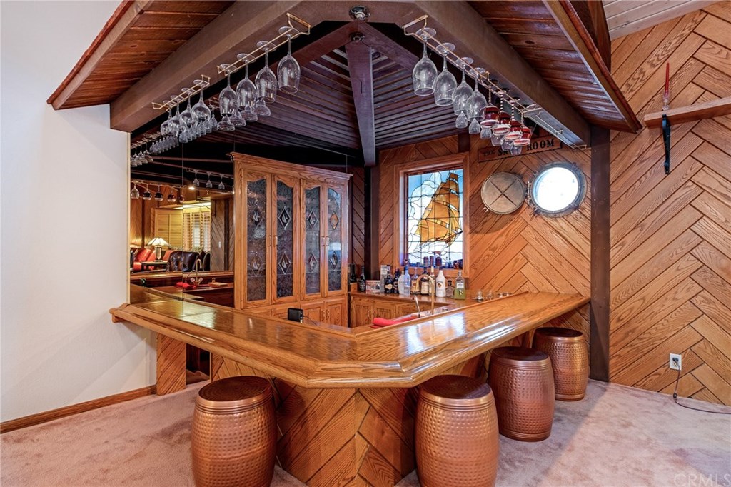 488 Highway 2 Wrightwood, CA 92397 - Photo 27 of 54 a room with stainless steel appliances wooden floor and dining table