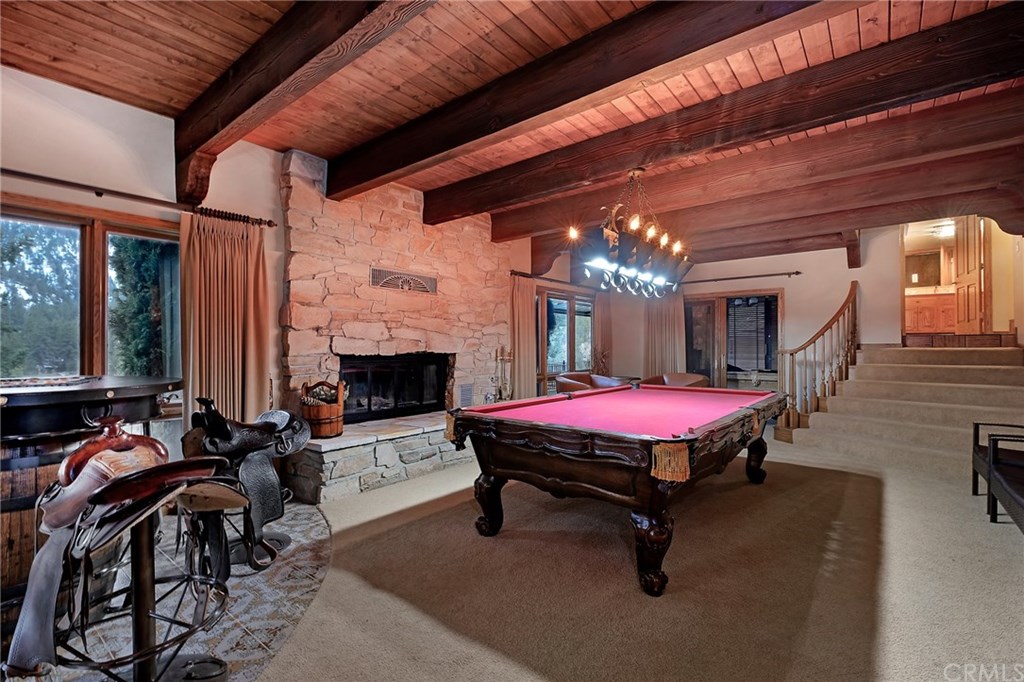 488 Highway 2 Wrightwood, CA 92397 - Photo 30 of 54 a living room with furniture a fireplace and a table