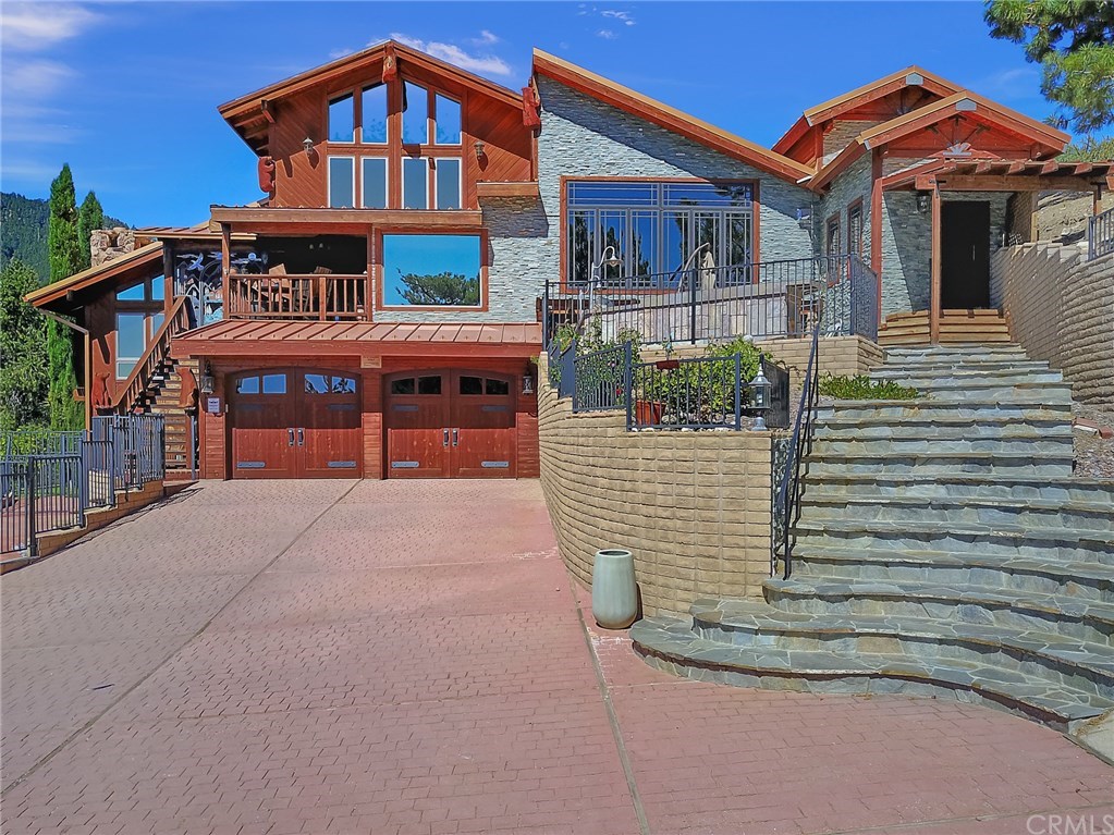 488 Highway 2 Wrightwood, CA 92397 - Photo 4 of 54 a front view of a house with garden