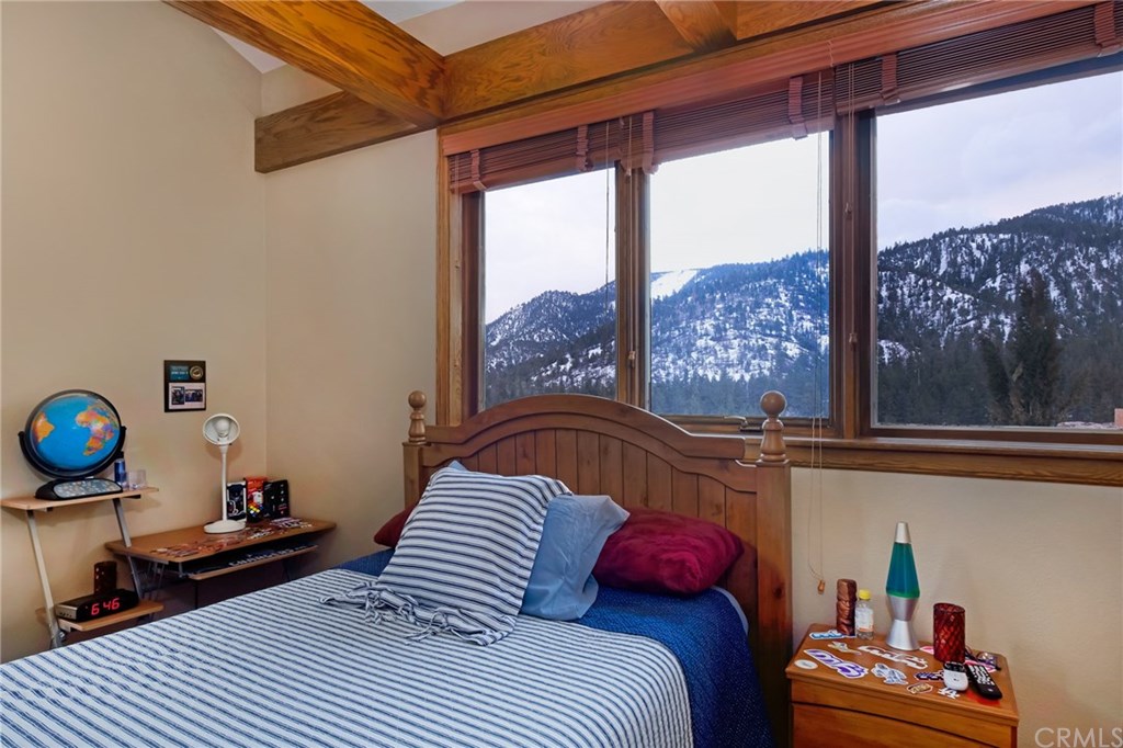 488 Highway 2 Wrightwood, CA 92397 - Photo 45 of 54 a bedroom with a bed and a window