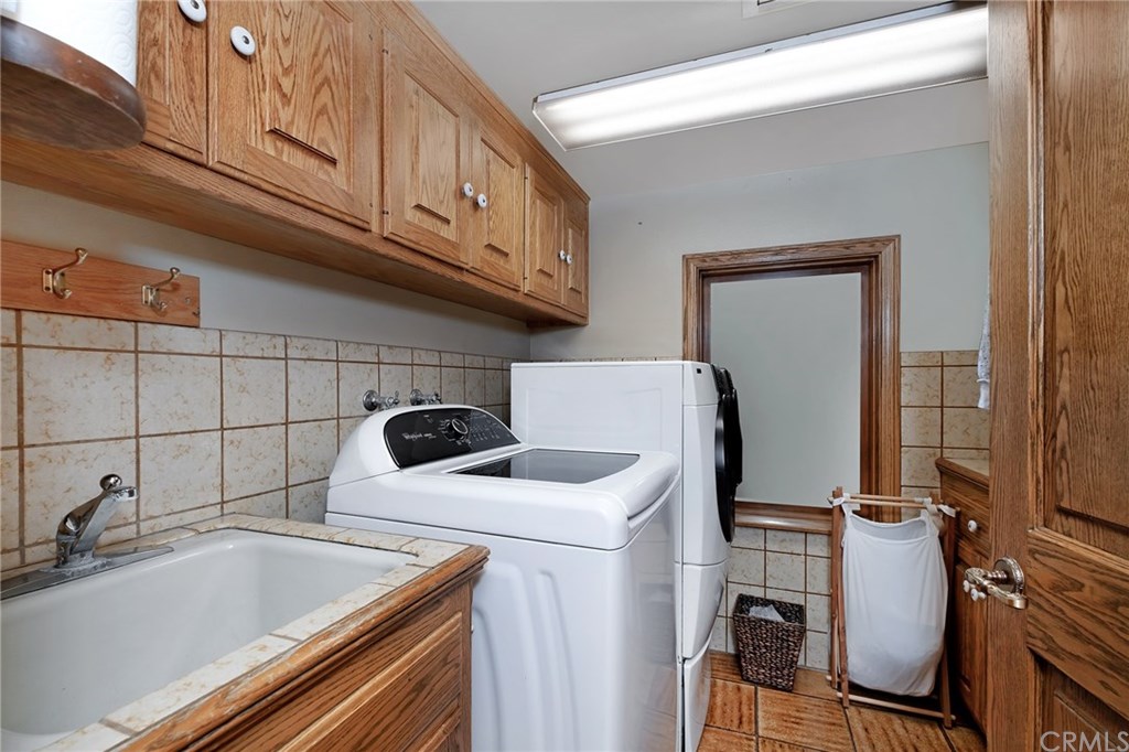 488 Highway 2 Wrightwood, CA 92397 - Photo 47 of 54 a utility room with dryer and washer