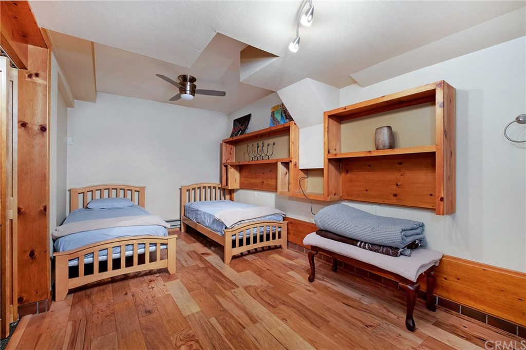 488 Highway 2 Wrightwood, CA 92397 - Photo 48 of 54 a bedroom with furniture and wooden floor