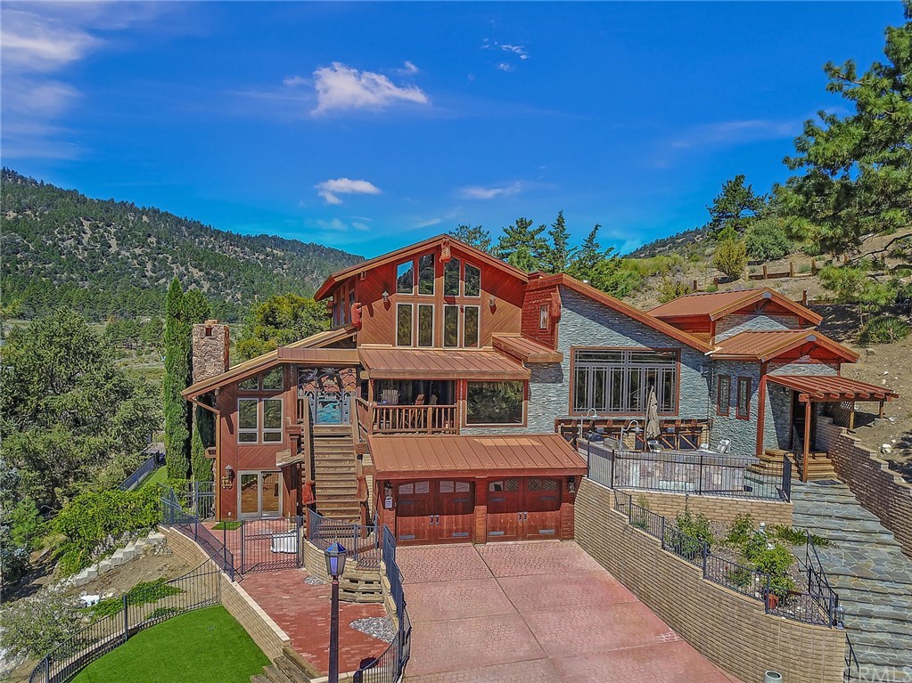 488 Highway 2 Wrightwood, CA 92397 - Photo 5 of 54 a view of a house with a patio