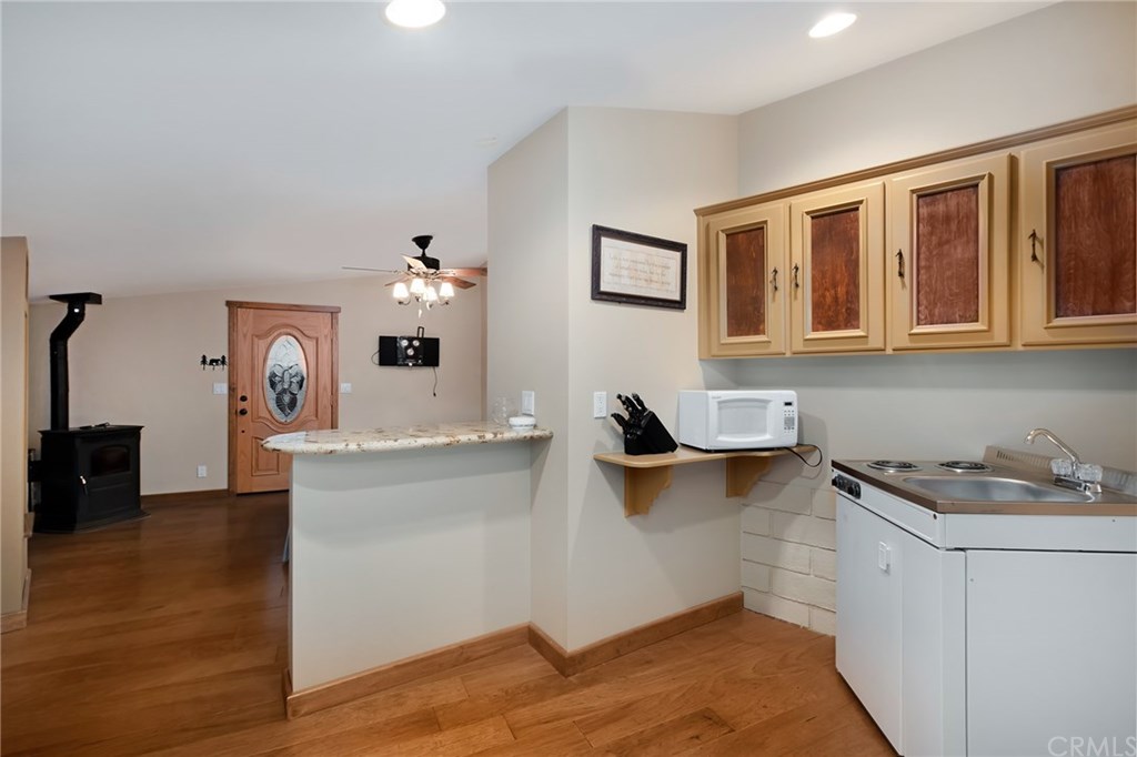 488 Highway 2 Wrightwood, CA 92397 - Photo 53 of 54 a kitchen with a sink and cabinets