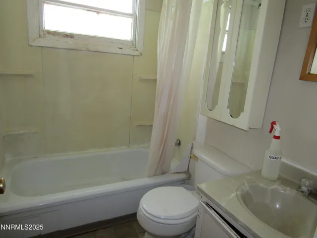 a kitchen with a refrigerator and a sink