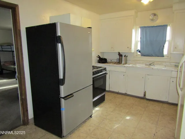 a bathroom with a double vanity sink and mirror