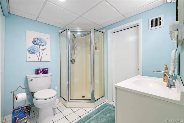 a bathroom with a toilet sink and shower