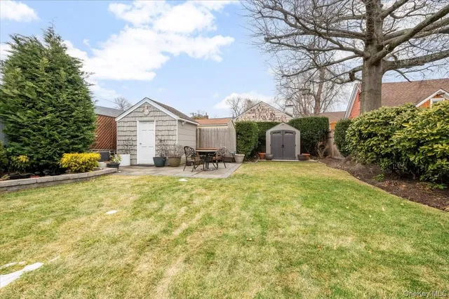 a view of a house with pool and chairs