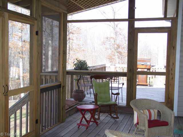 7805 Wilson Farm Road Summerfield, NC 27358 - Photo 7 of 9 Other. The deck is an extension of the screened porch, perfect for entertaining!
