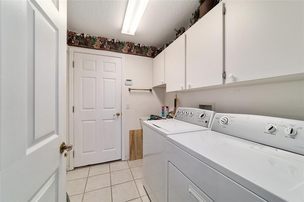 5245 Northwest 21st Loop Ocala, FL 34482 - Photo 12 of 26 a utility room with dryer and washer