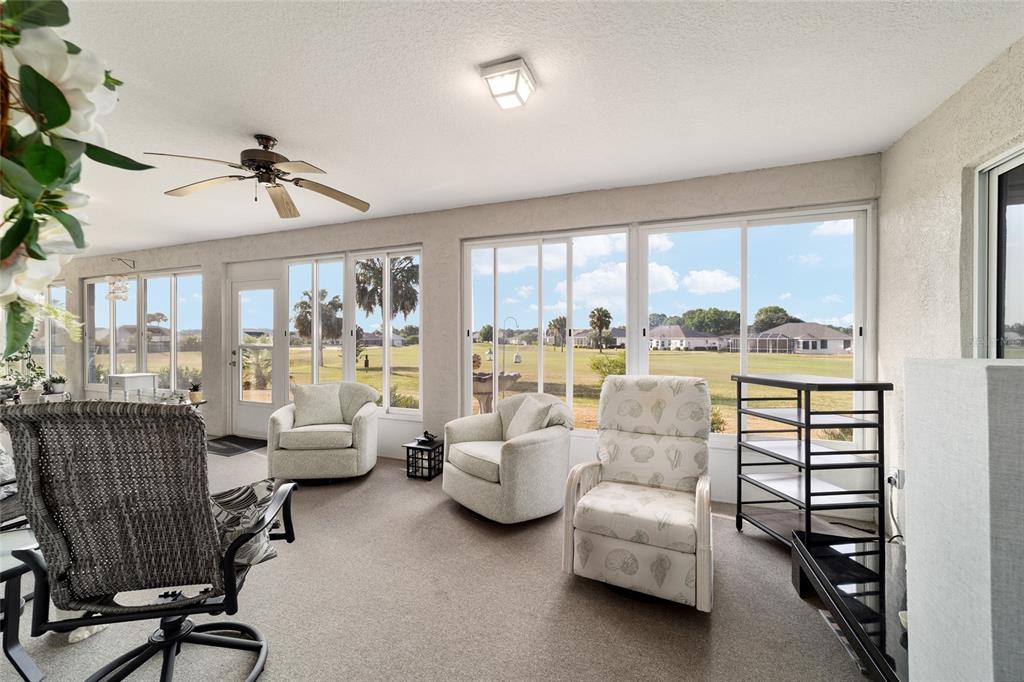 5245 Northwest 21st Loop Ocala, FL 34482 - Photo 21 of 26 a living room with furniture and a large window