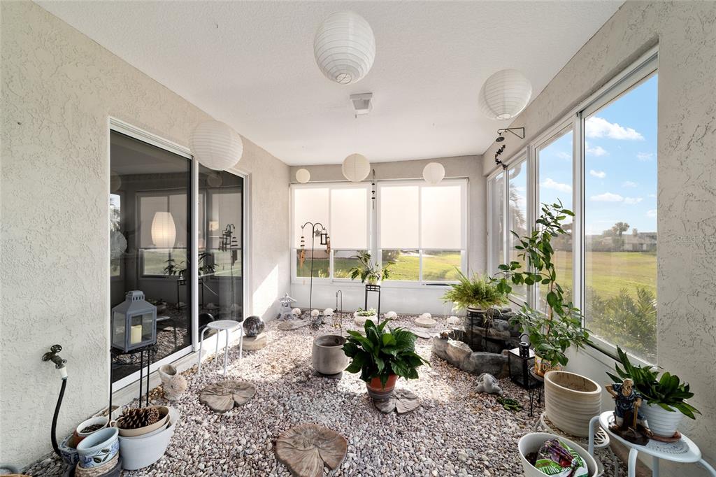 5245 Northwest 21st Loop Ocala, FL 34482 - Photo 22 of 26 a living room with furniture and a potted plant