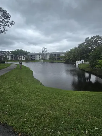 a view of a lake with a big yard