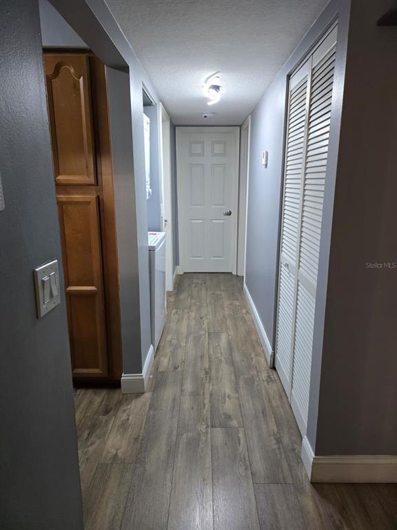 1624 South Pine Ridge Circle, Unit D2 Sanford, FL 32773 - Photo 5 of 14 a view of hallway with wooden floor