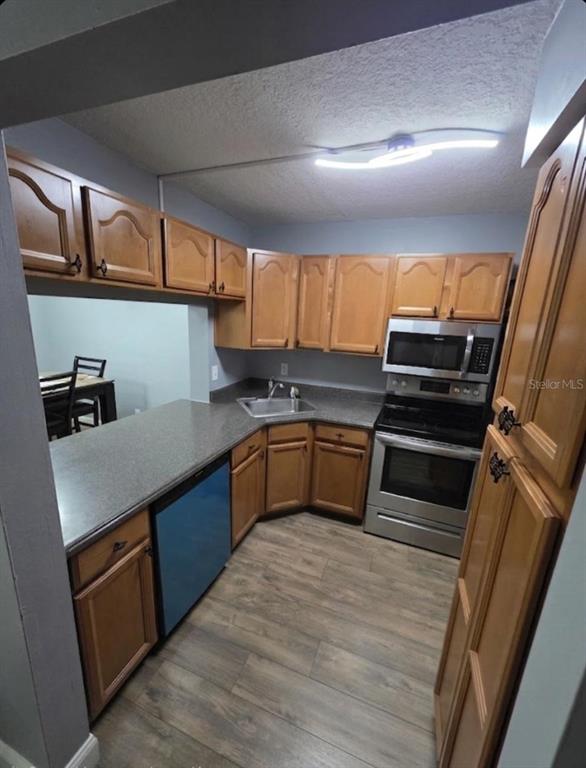 1624 South Pine Ridge Circle, Unit D2 Sanford, FL 32773 - Photo 10 of 14 a kitchen with granite countertop a sink and cabinets