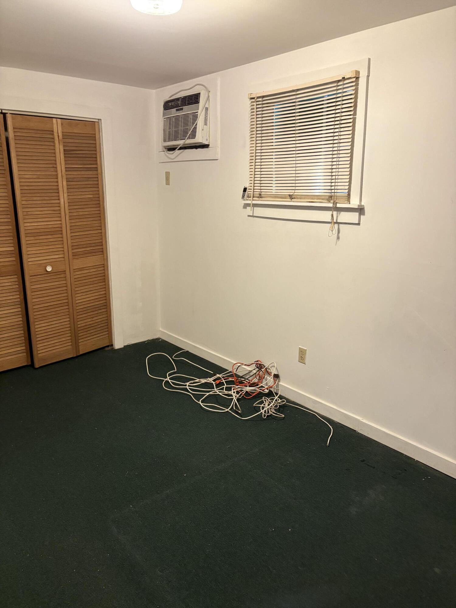 705 Chapman Lane Key West, FL 33040 - Photo 16 of 24 a room with a bed and a window