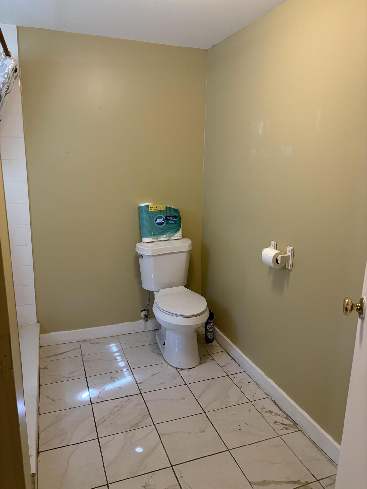 705 Chapman Lane Key West, FL 33040 - Photo 17 of 24 a bathroom with a toilet and a sink