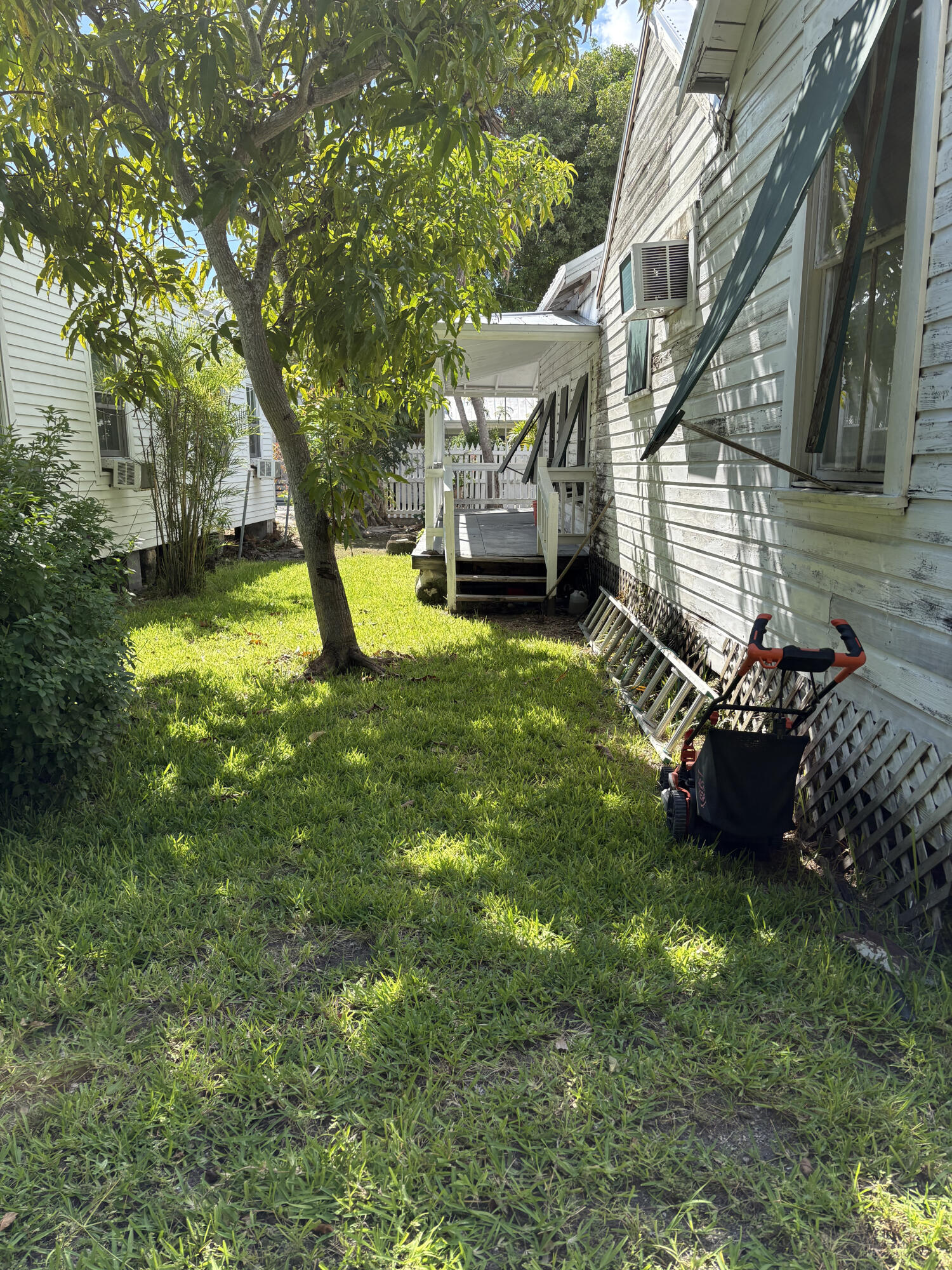 705 Chapman Lane Key West, FL 33040 - Photo 9 of 24 a view of a house with a back yard